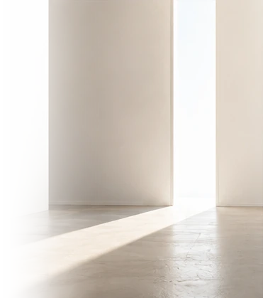 Light entering a pale room through an open doorway